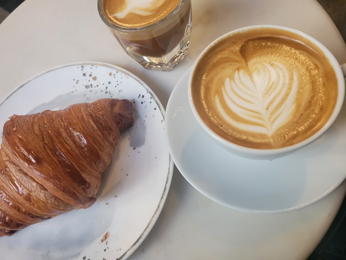 Espresso and croissant at Black Wolf Coffee