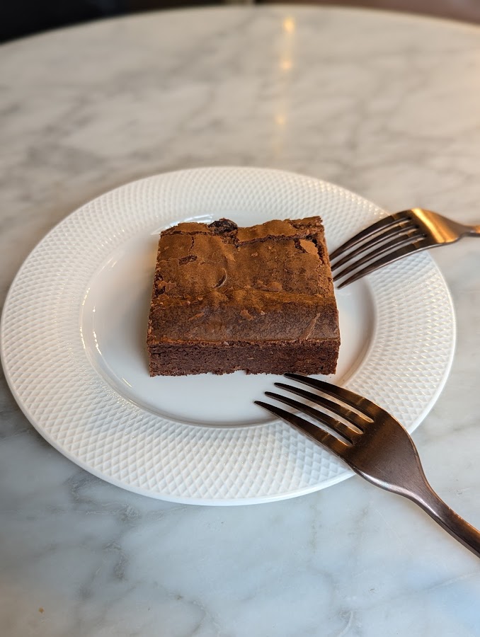 Brownie square plated on marble table